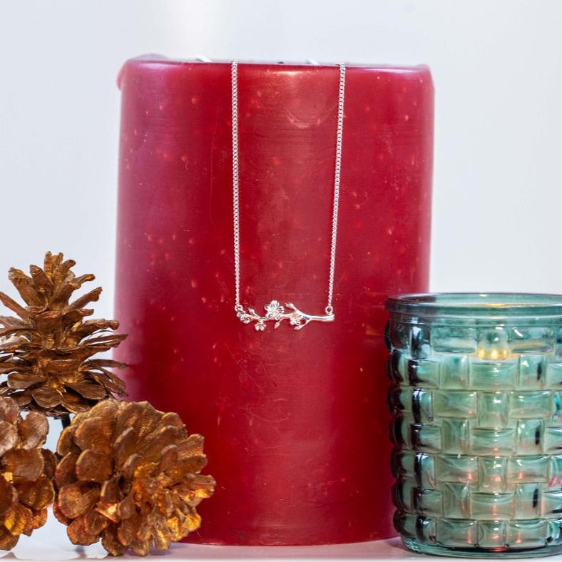 “Christian almond blossom necklace inspired by scripture.”
