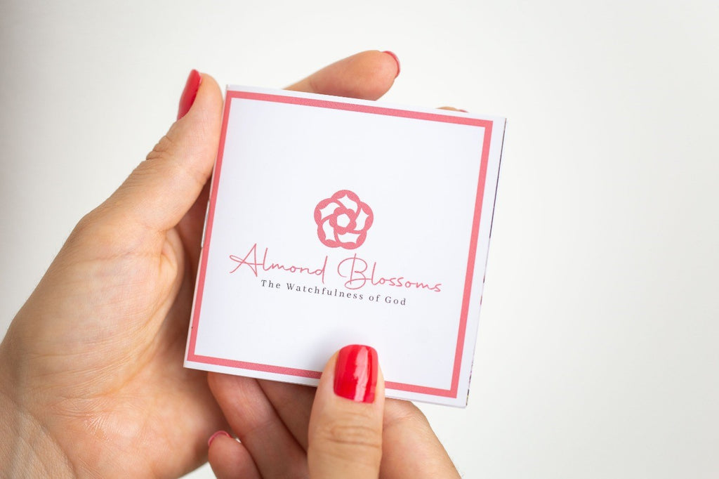 a woman holding a booklet 