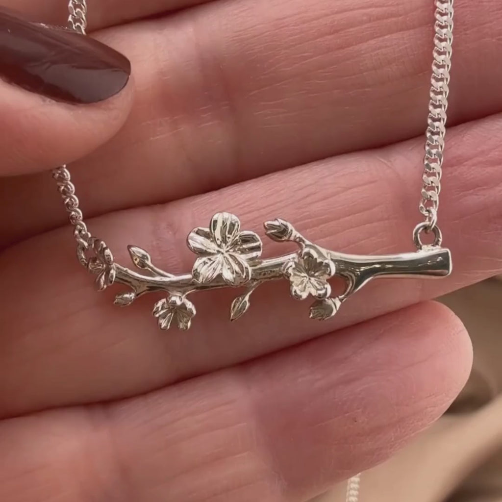 Video of our Esther Courage Necklace - Watched with Purpose in Sterling silver, showing the details of this Christian necklace displayed on the hand of a woman.