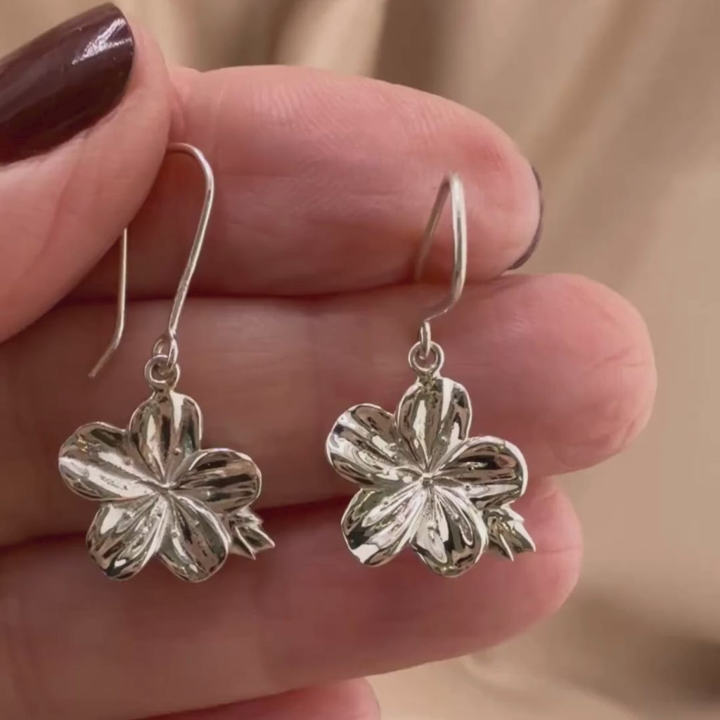 Video of almond blossom earrings in Sterling silver, showing the details of these Christian earrings displayed on the hand of a woman.