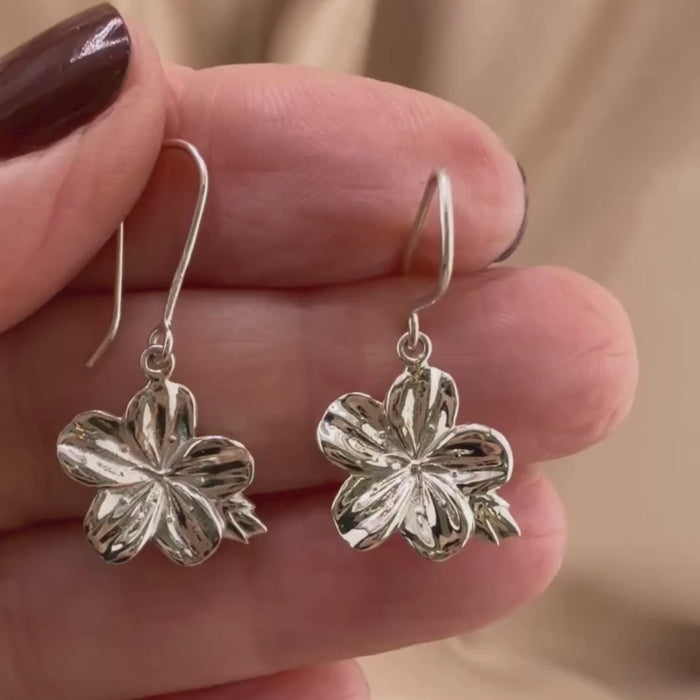 Video of almond blossom earrings in Sterling silver, showing the details of these Christian earrings displayed on the hand of a woman.