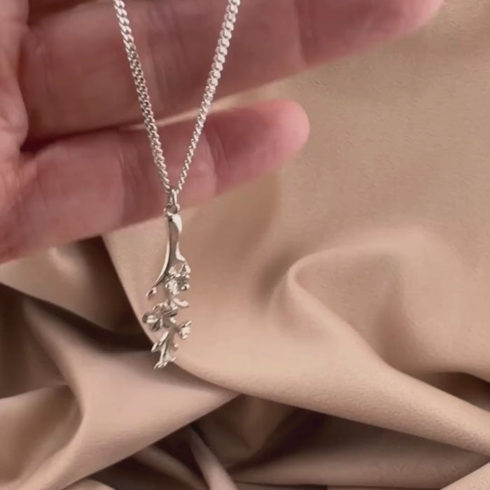 Video of our Esther Courage Necklace - Watched with Purpose in Sterling silver, showing the details of this Christian necklace displayed on the hand of a woman.