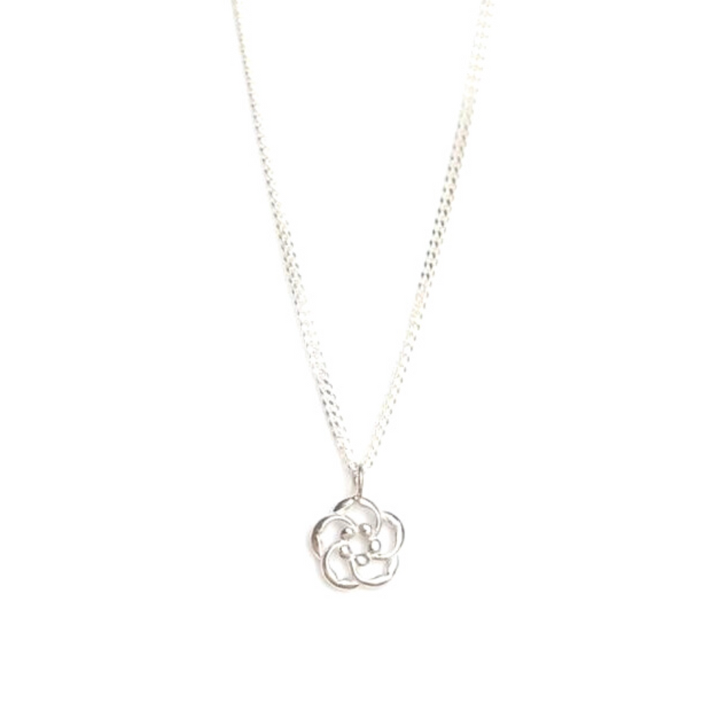 Our almond blossom logo Christian necklace in sterling silver as a reminder that God is lovingly watching over you at all times.. Pictured in a white background