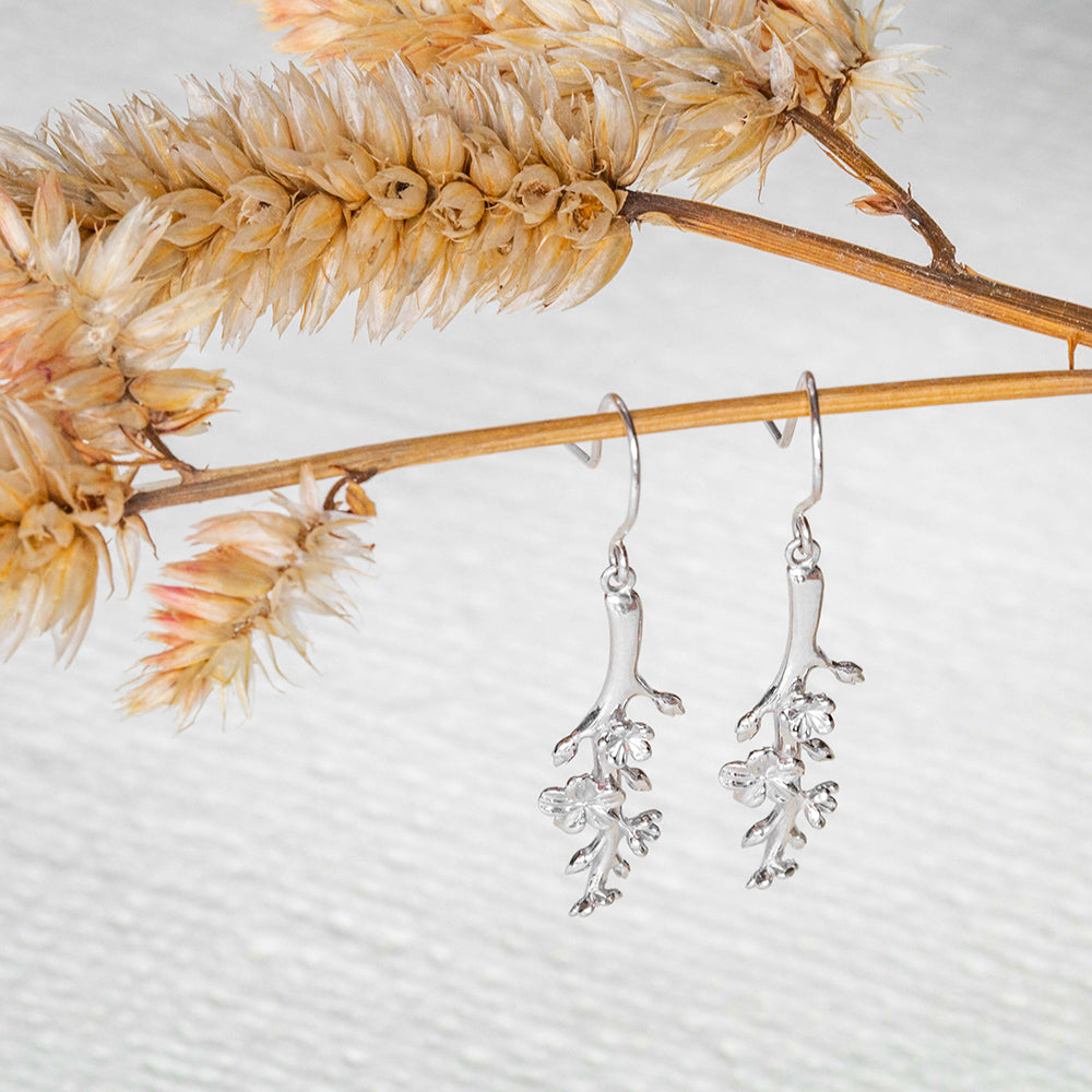 Our Esther Christian Earrings, the branch of an almond tree in sterling silver hook style dangling off of a dried flower stem 