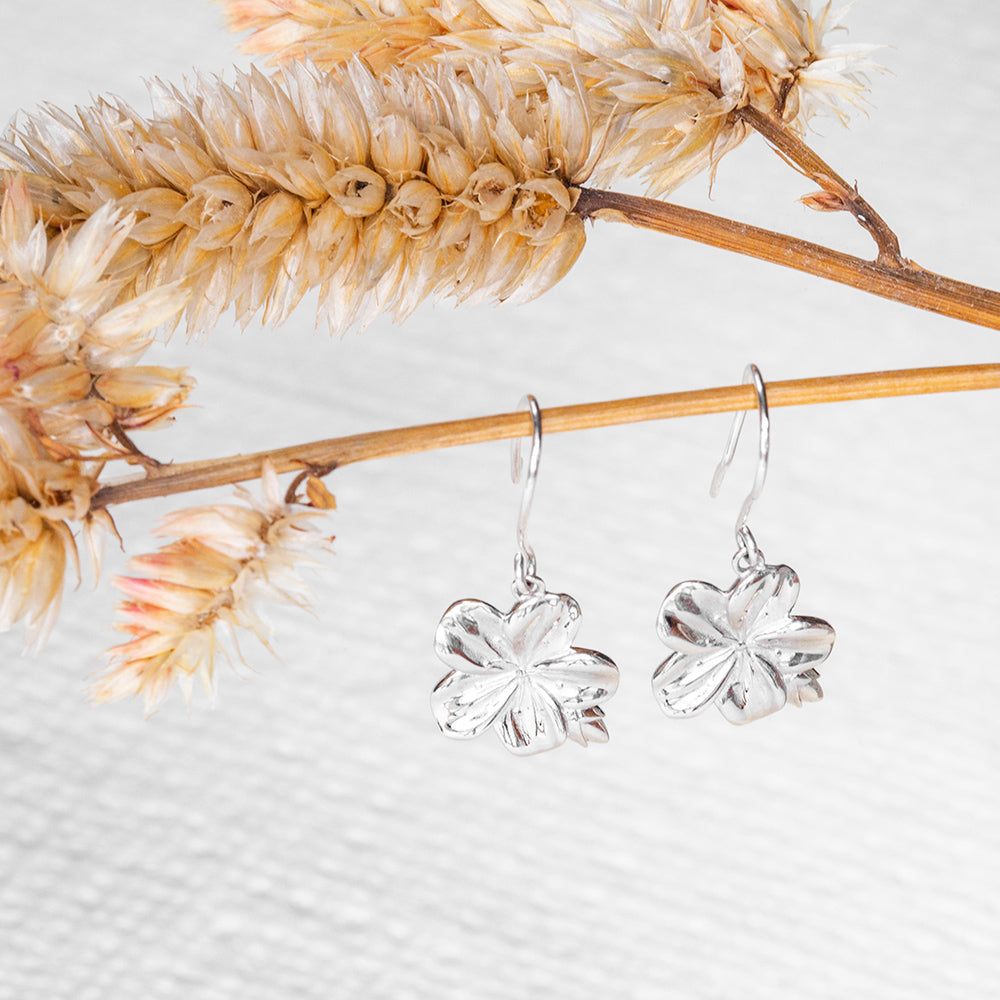 Sterling silver Christian earrings of an almond blossom and bud, inspired by the Word of God as a reminder of His watchfulness over you life. Hook style hanging off of dried flowers, from our Mary Magdalene Collection
