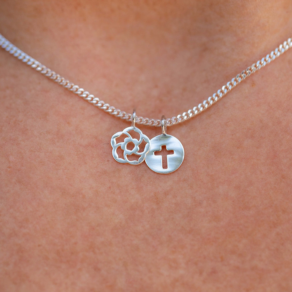 Our logo of an almond blossom with the Biblical significance of God's loving watchfulness and the cross of Jesus reminds us that we are not alone. Christian necklace in sterling silver. 